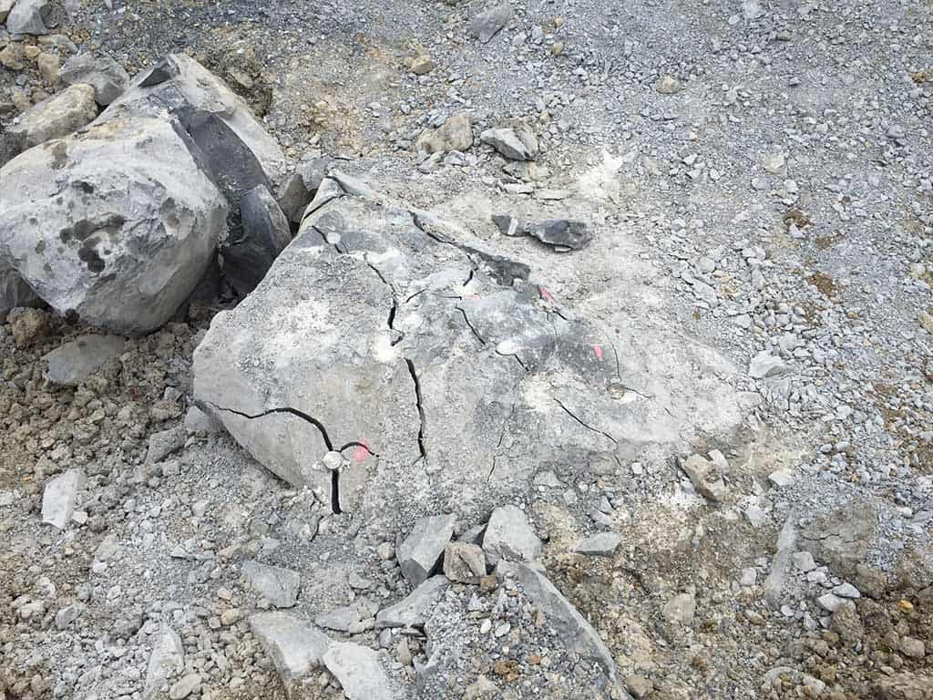 Remove rock outcrop with source explosives